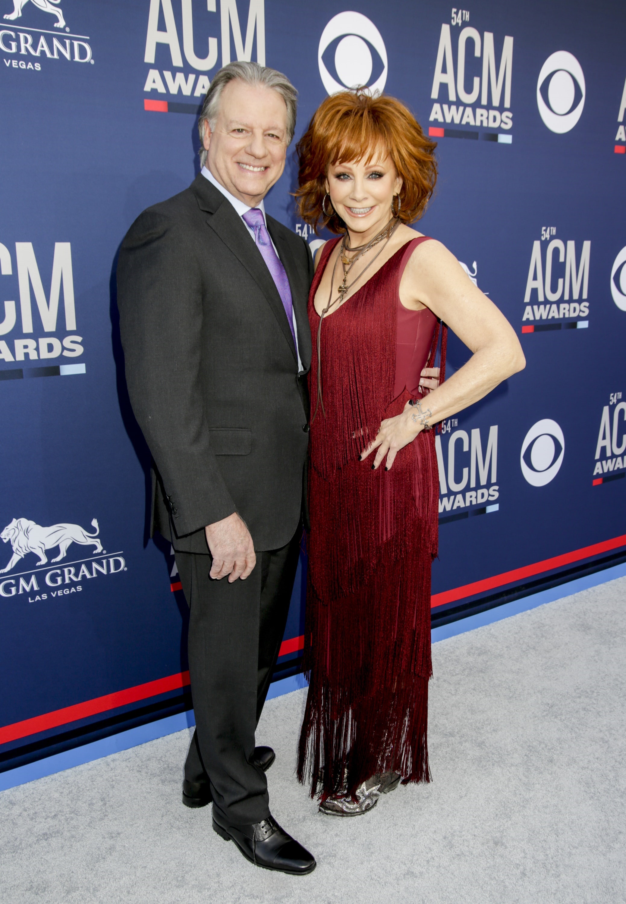 Host Reba McEntire with Anthony "Skeeter" Lasuzzo attends the 54TH ACADEMY OF COUNTRY MUSIC AWARDS, to broadcast LIVE from MGM Grand Garden Arena in Las Vegas Sunday, April 7, 2019 (8:00-11:00 PM, ET/delayed PT) on the CBS Television Network. Photo: Francis Specker/CBS Â©2019 CBS Broadcasting, Inc. All Rights Reserved.