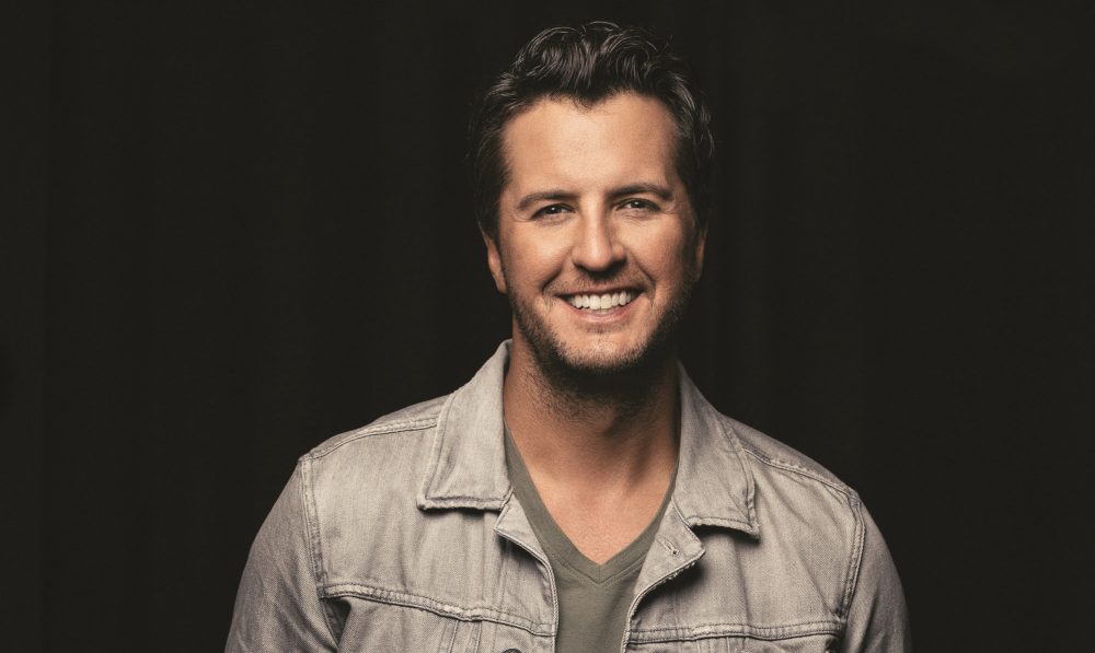 Luke Bryan Opens ACM Entertainer of the Year Trophy (With The Help of Cole Swindell)