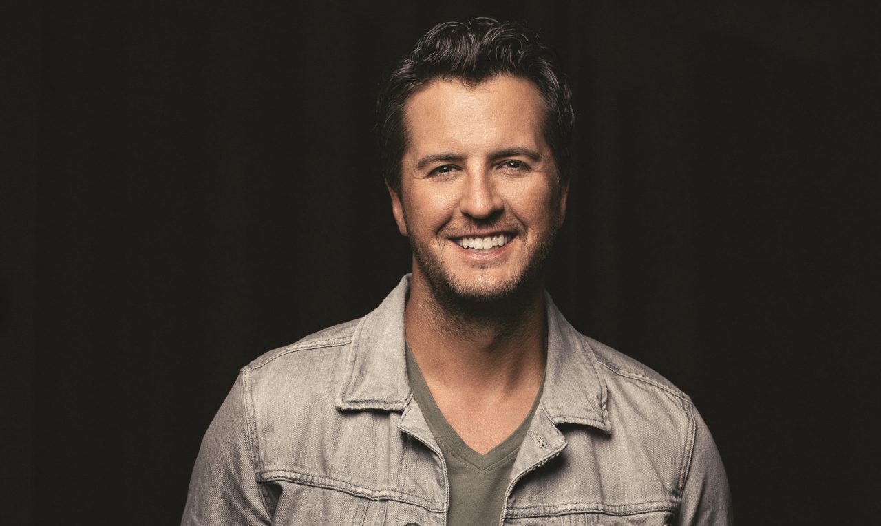 Luke Bryan Opens ACM Entertainer of the Year Trophy (With The Help of Cole Swindell)